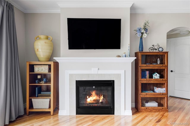 111 S Monroe St Unit B106, Denver, CO 80209 - detailed view of wood finished floors, arched walkways, a glass covered fireplace, and ornamental molding