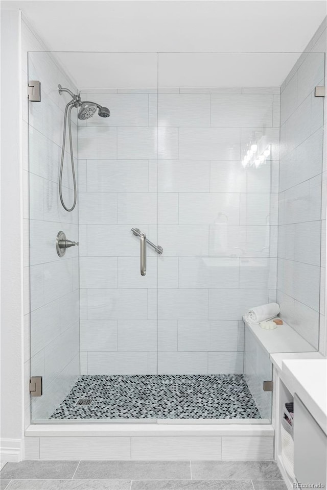 111 S Monroe St Unit B106, Denver, CO 80209 - bathroom featuring a stall shower, vanity, and tile patterned flooring