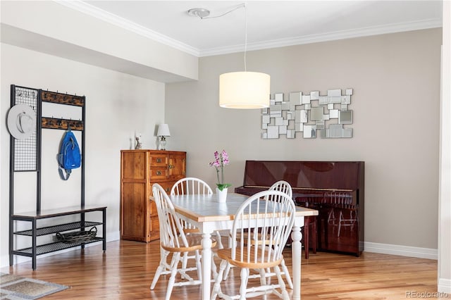 111 S Monroe St Unit B106, Denver, CO 80209 - dining area with light wood finished floors and ornamental molding
