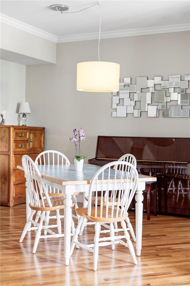 111 S Monroe St Unit B106, Denver, CO 80209 - dining area with light wood finished floors and ornamental molding