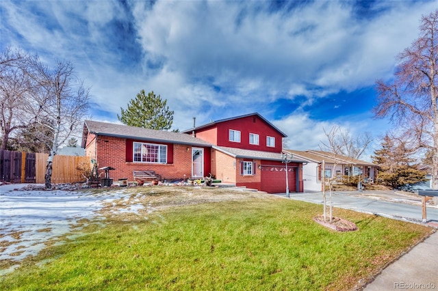 view of front of house featuring a garage and a front lawn