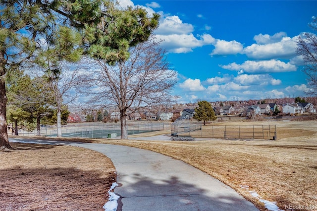 view of property's community featuring a lawn