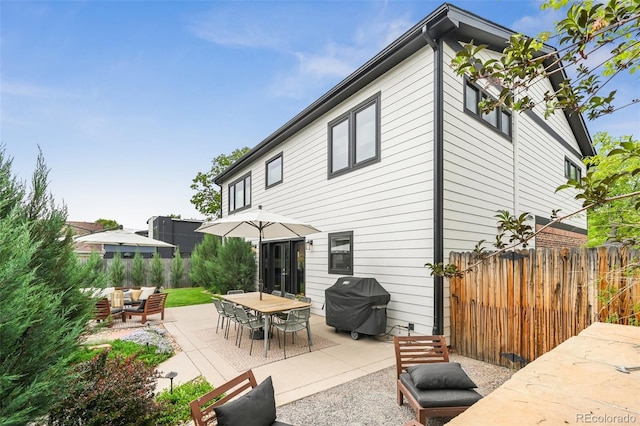 2480 Quitman St, Denver, CO 80212 - back of property with a patio, fence, and an outdoor hangout area