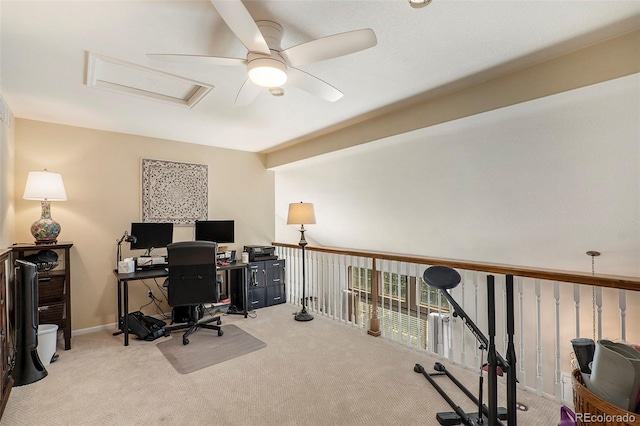 carpeted home office with ceiling fan