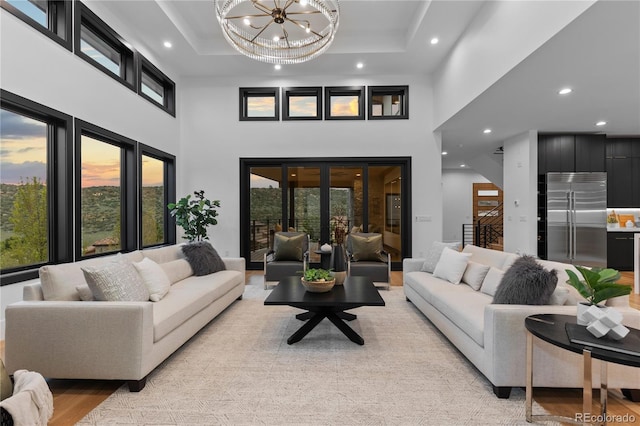 8103 Raphael Ln, Littleton, CO 80125 - living room with an inviting chandelier, recessed lighting, and a high ceiling