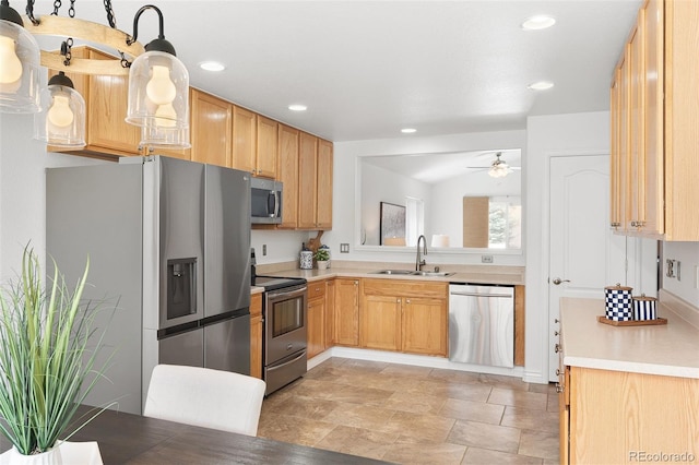 kitchen featuring ceiling fan, appliances with stainless steel finishes, a sink, light countertops, and recessed lighting