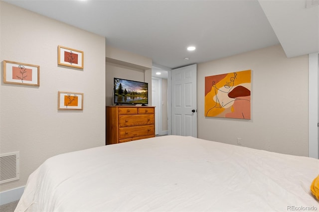 bedroom with recessed lighting and visible vents
