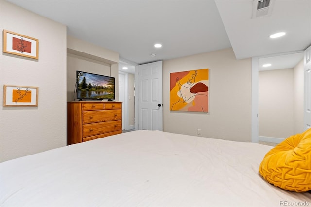 bedroom featuring baseboards, visible vents, and recessed lighting