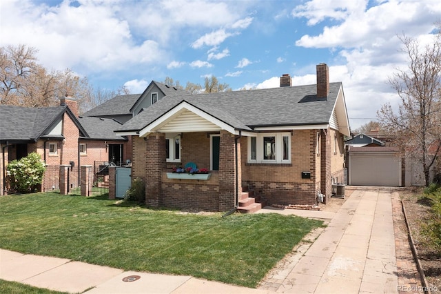 bungalow with a detached garage, a chimney, brick siding, an outdoor structure, and a front yard