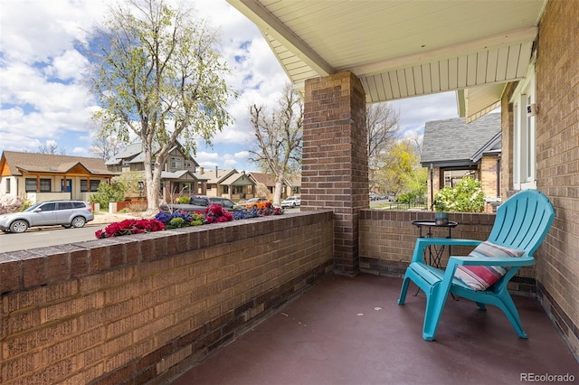 view of patio with a porch and a residential view