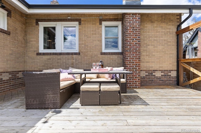 wooden terrace featuring outdoor lounge area