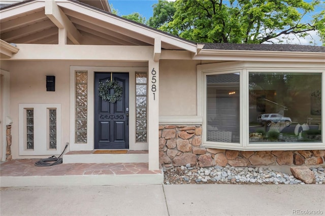 6581 E Heritage Pl, Englewood, CO 80111 - property entrance with stone siding and stucco siding