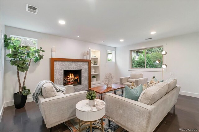 6581 E Heritage Pl, Englewood, CO 80111 - living room with a tiled fireplace, dark wood-style floors, and recessed lighting
