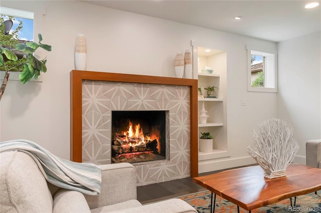 6581 E Heritage Pl, Englewood, CO 80111 - living room with a warm lit fireplace, recessed lighting, and wood finished floors