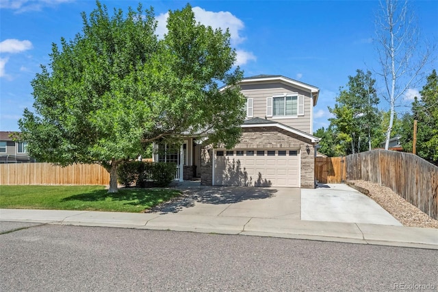 12961 Monaco Way, Thornton, CO 80602 - view of property hidden behind natural elements with a garage, concrete driveway, and brick siding
