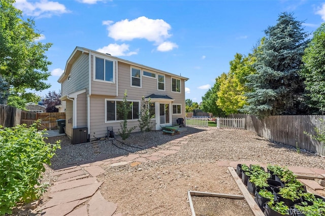 12961 Monaco Way, Thornton, CO 80602 - back of property with a garden, a fenced backyard, and a patio area