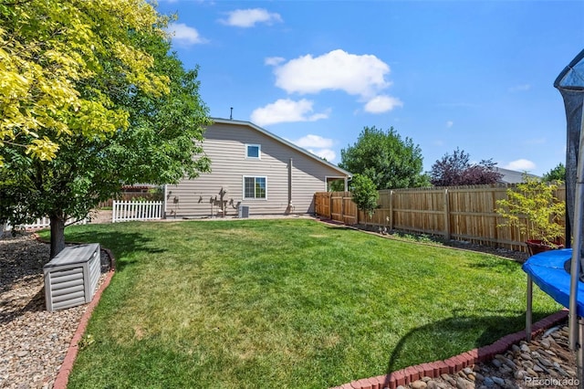 12961 Monaco Way, Thornton, CO 80602 - fenced backyard with a trampoline