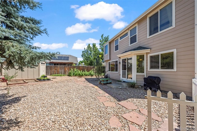 12961 Monaco Way, Thornton, CO 80602 - fenced backyard with a storage unit