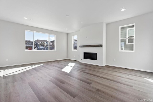 unfurnished living room featuring light hardwood / wood-style flooring