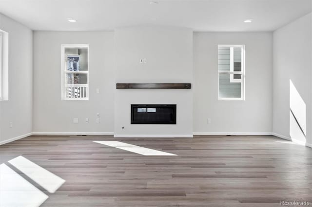 unfurnished living room featuring light wood-type flooring