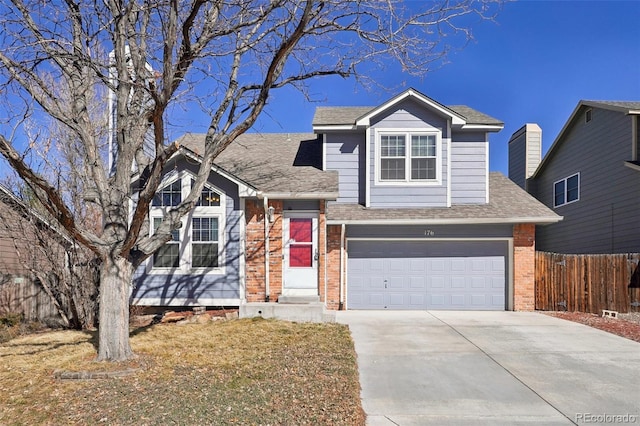 view of front of house featuring a garage, a shingled roof, concrete driveway, fence, and brick siding