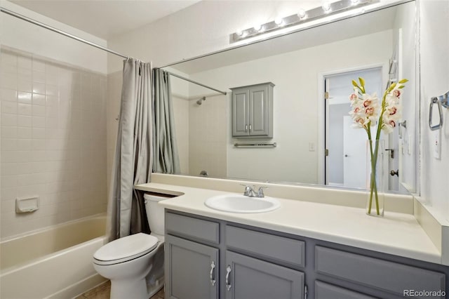 full bathroom featuring toilet, shower / bath combination with curtain, and vanity