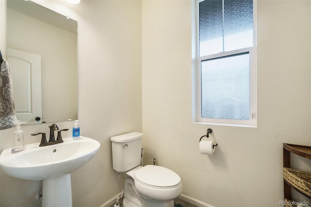 bathroom with toilet and sink