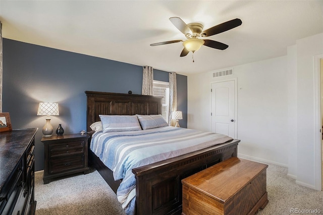 bedroom with ceiling fan and light carpet