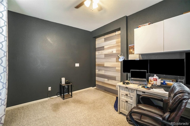 office area featuring ceiling fan and light carpet