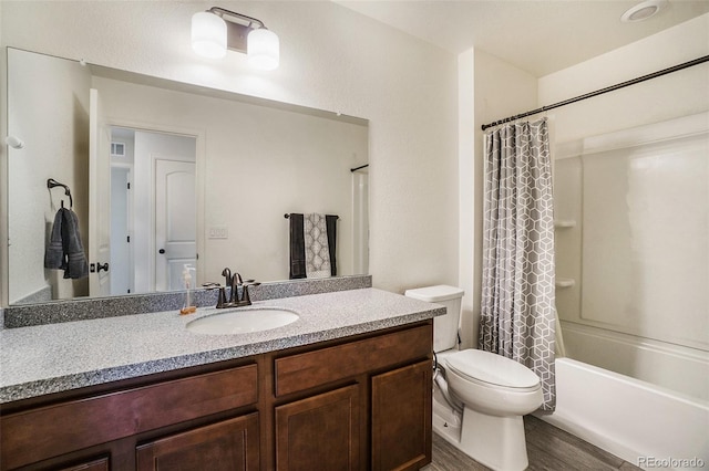 full bathroom with toilet, shower / tub combo, hardwood / wood-style flooring, and vanity