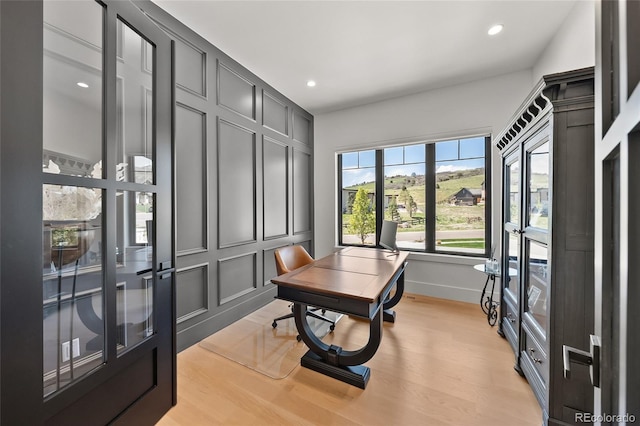 office featuring light wood-style floors, baseboards, and recessed lighting