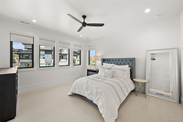 bedroom featuring light carpet, recessed lighting, and visible vents