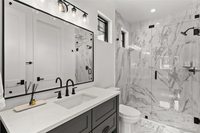 full bathroom featuring vanity, toilet, marble finish floor, a marble finish shower, and recessed lighting
