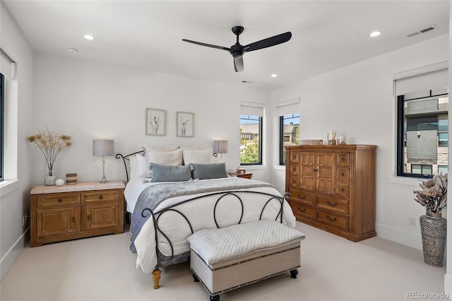 bedroom with visible vents, baseboards, light colored carpet, recessed lighting, and a ceiling fan