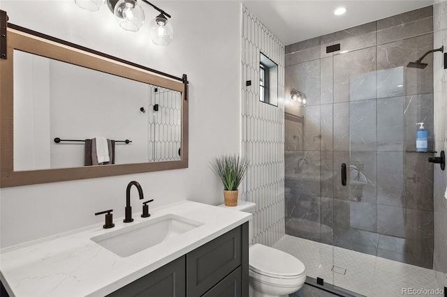 full bath featuring vanity, recessed lighting, a stall shower, and toilet
