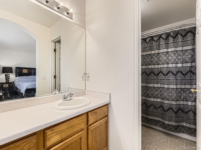 9832 Kenton Cir, Commerce City, CO 80022 - bathroom featuring vanity, connected bathroom, and a shower with shower curtain
