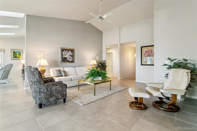 living area featuring high vaulted ceiling, ceiling fan, baseboards, and light tile patterned flooring