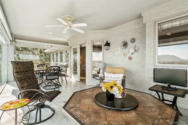 sunroom featuring a wealth of natural light and tile patterned floors