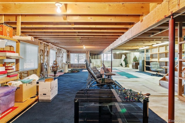 below grade area with stairs and carpet flooring
