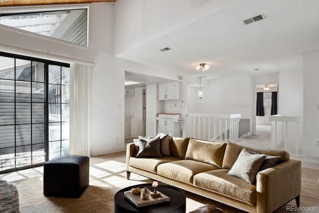 12622 E Warren Dr Unit E, Aurora, CO 80014 - living room with baseboards and a towering ceiling