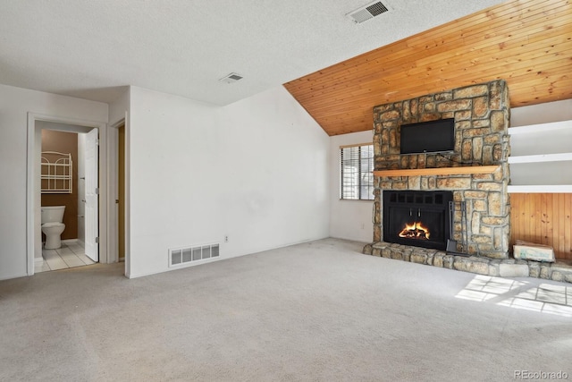 12622 E Warren Dr Unit E, Aurora, CO 80014 - unfurnished living room with carpet flooring, a fireplace, and visible vents