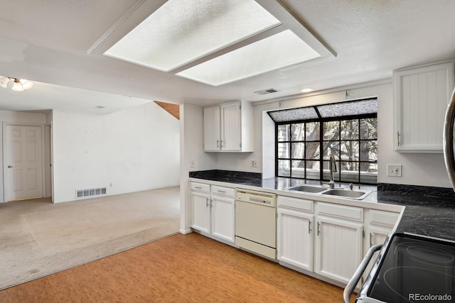 12622 E Warren Dr Unit E, Aurora, CO 80014 - kitchen featuring a sink, visible vents, range with electric stovetop, and dishwasher