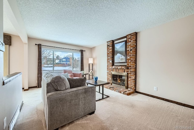 living room featuring light colored carpet, a fireplace, and a textured ceiling