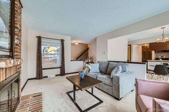 living room featuring light carpet, a brick fireplace, and a textured ceiling