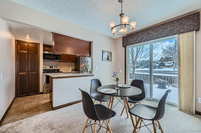 carpeted dining space featuring a textured ceiling and a chandelier