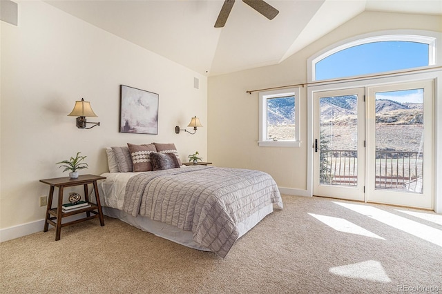 bedroom featuring lofted ceiling, access to outside, light carpet, and baseboards