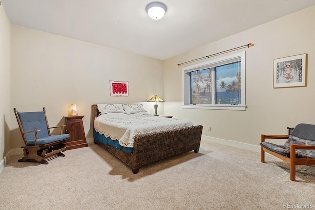 carpeted bedroom with baseboards