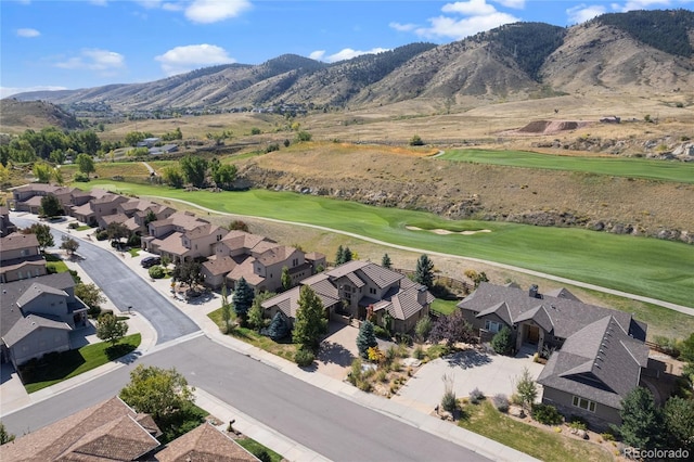 bird's eye view with a residential view, a mountain view, and golf course view