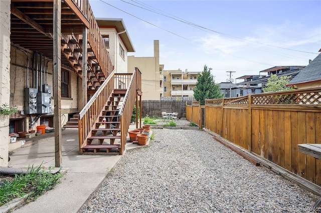 1331 N Ogden St Unit 1, Denver, CO 80218 - fenced backyard featuring stairs and a patio