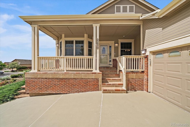 22873 E David Pl, Aurora, CO 80016 - view of exterior entry featuring covered porch and driveway